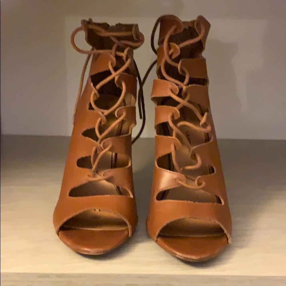 Strappy brown high heel sandals.